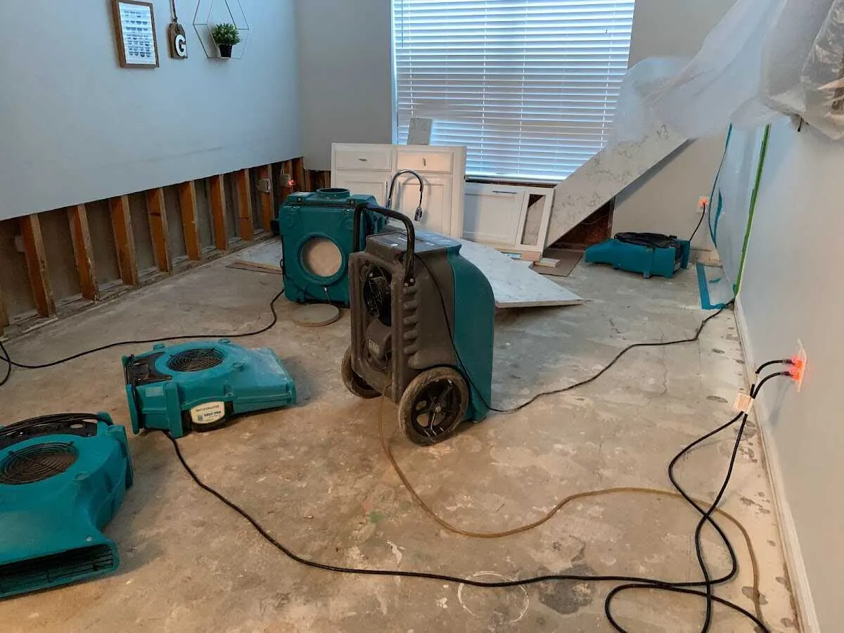 Dehumidifier in flood-cut room for Water Damage Restoration in Cicero